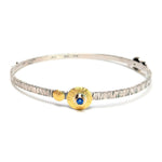 Sterling Silver and 22k Gold Bracelet with Blue Topaz and Red Garnet